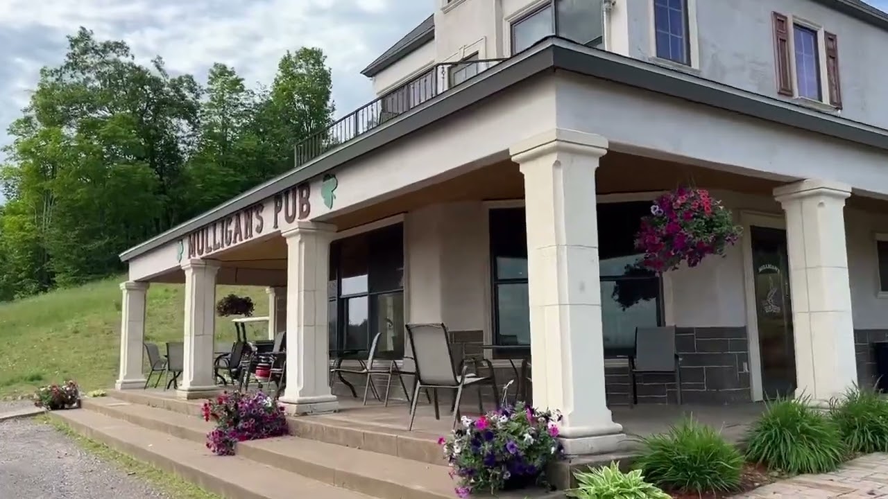 Mulligan’s Pub porch with hanging flower baskets