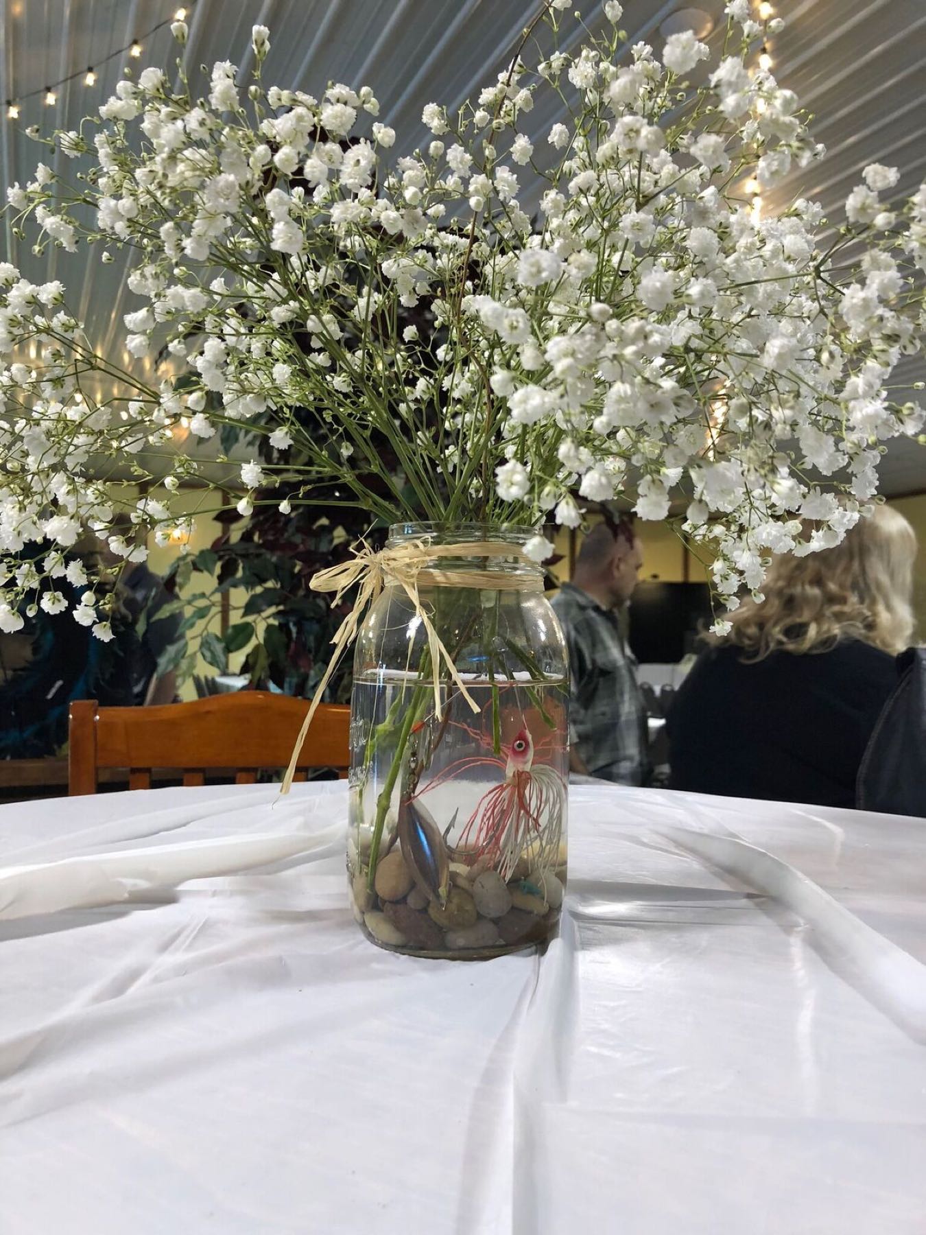 Table centrepiece of baby’s breath in the Event Center
